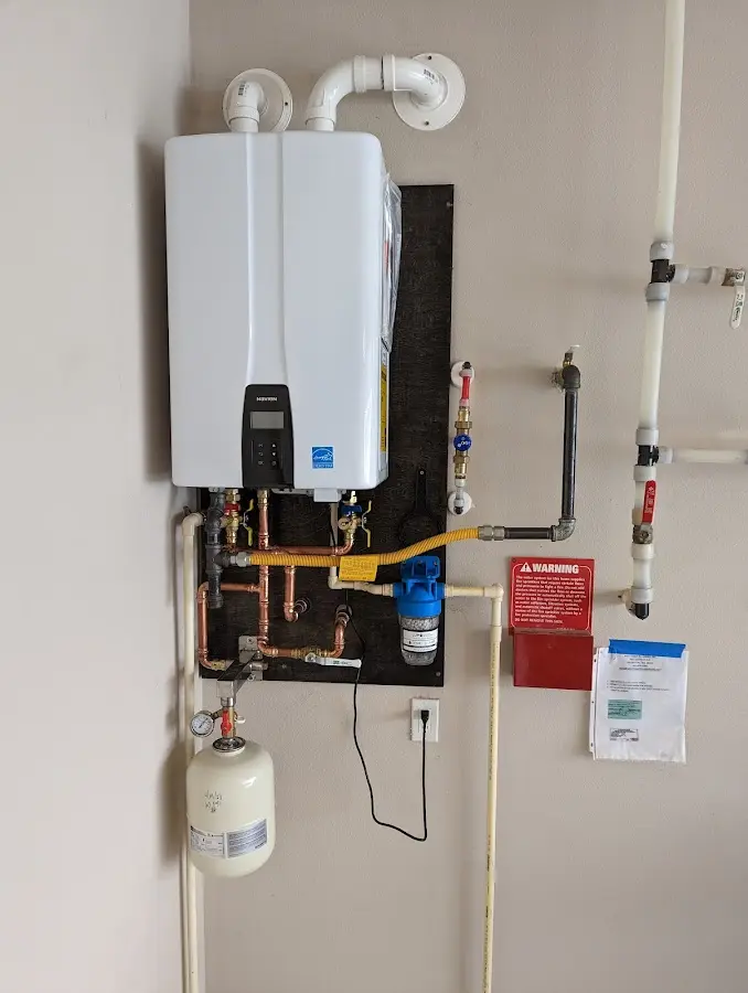 Professional plumber installing copper piping in a Reading home